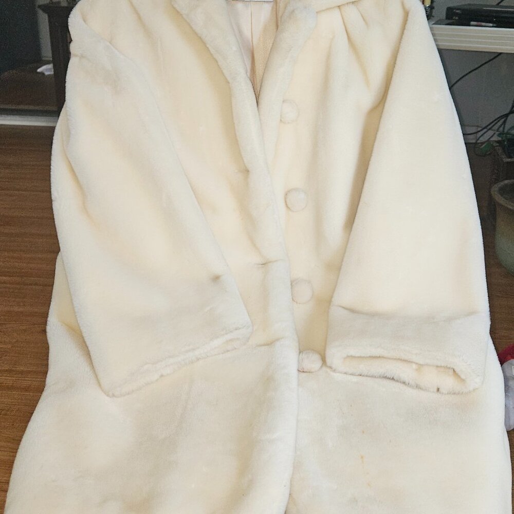 Colors of Benneton cream colored coat in mint condition.